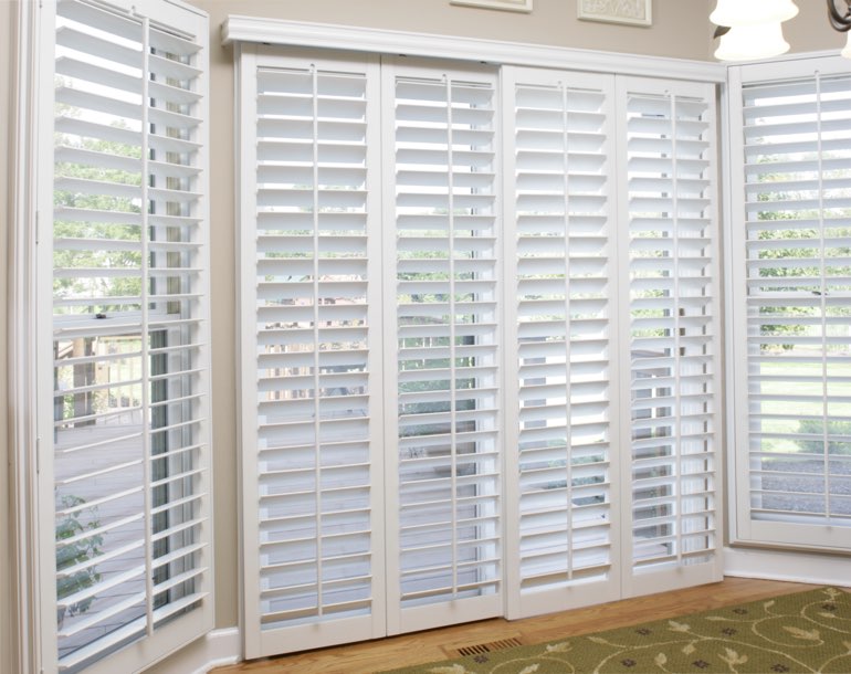 Sliding glass door with white shutters Southern California